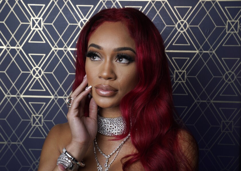 Rapper Saweetie poses for a portrait at Nightingale Plaza in Los Angeles on Dec. 2, 2021. Saweetie was named one of AP's breakthrough entertainers of the year. (AP Photo/Chris Pizzello)