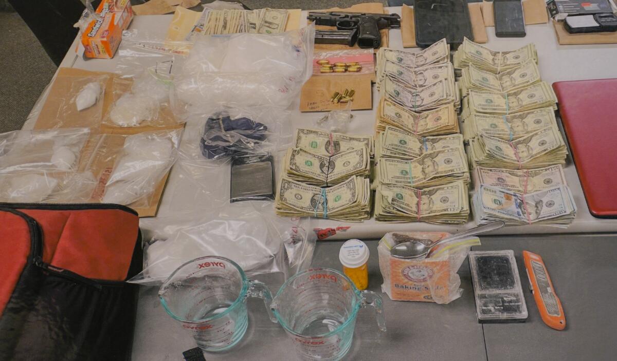 Investigators showcase drugs, cash seized during a year-long operation in East Village.
