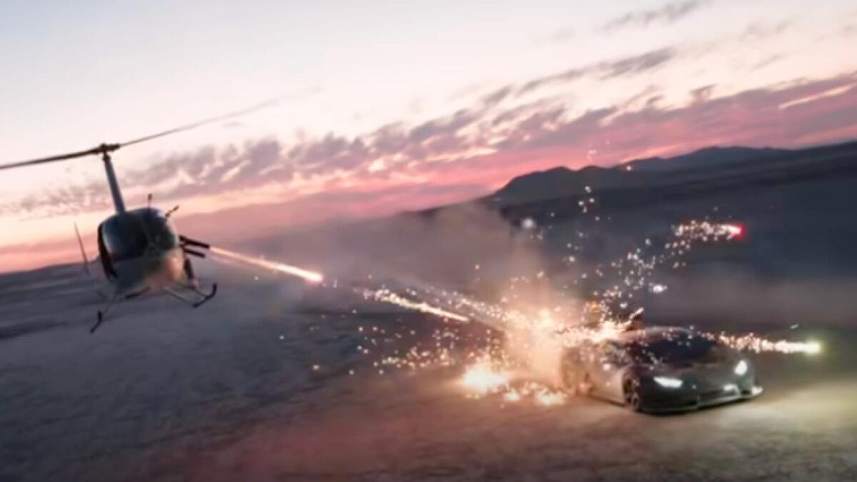 Image from U.S. District Court indictment shows fireworks being discharged from a helicopter toward a car on the ground.