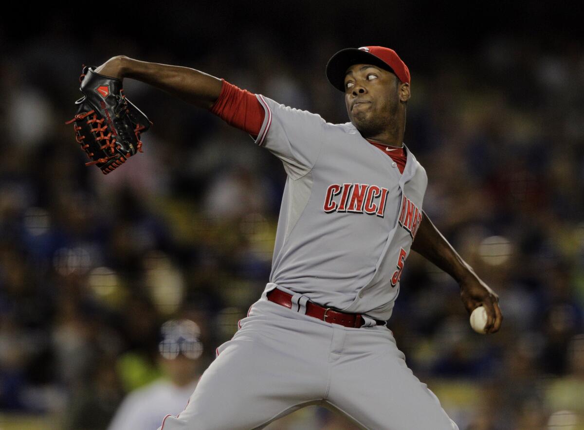 Cincinnati Reds closer Aroldis Chapman prepares to unleash a 102-mph pitch on his way to registering a save against the Dodgers in a 2013 game.