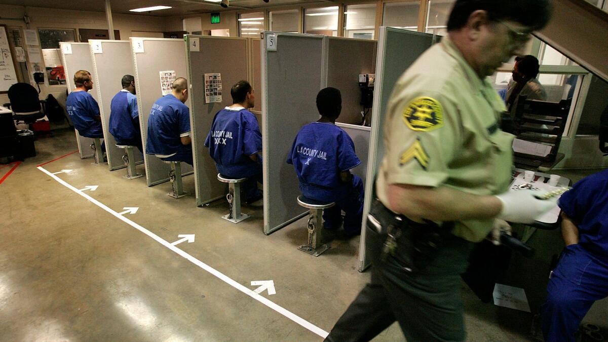 Inmates sitting in the inmate reception center in the Twin Towers jail in 2006. A 28-year-old man was arrested this week on suspicion of attempting to slip into the facility using fake FBI credentials.