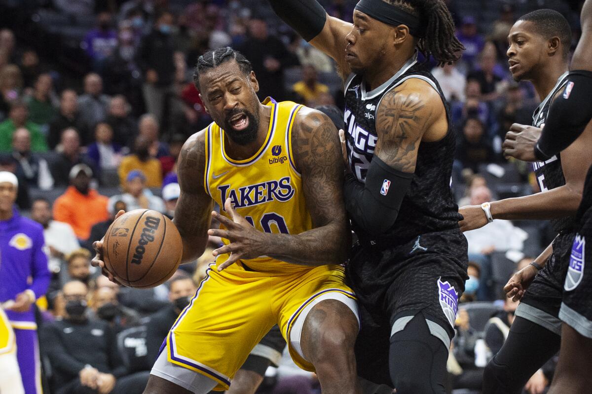 Lakers center DeAndre Jordan tries to drive past Sacramento Kings center Richaun Holmes during a game on Nov. 30.
