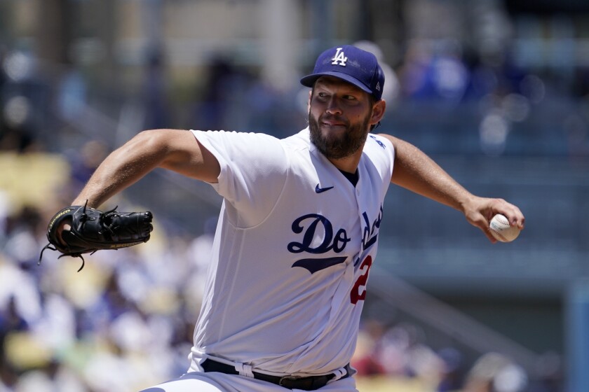Dodgers starting pitcher Clayton Kershaw throws to the plate against the San Diego Padres Sunday