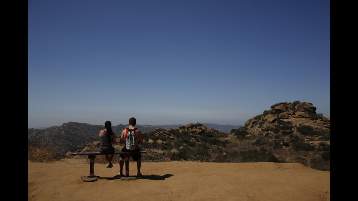 Hikers take a break along the Rocky Peak trail.