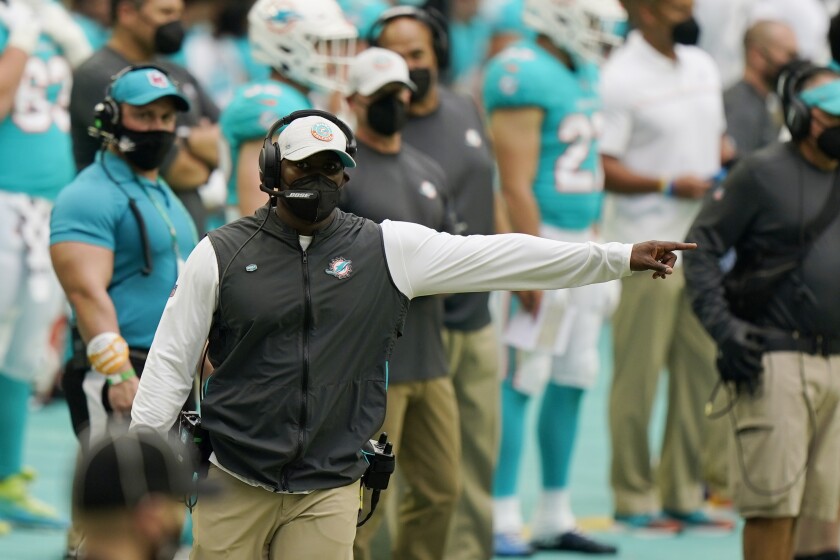Miami Dolphins head coach Brian Flores gestures during the second half of an NFL football game against the Cincinnati Bengals, Sunday, Dec. 6, 2020, in Miami Gardens, Fla. (AP Photo/Wilfredo Lee)