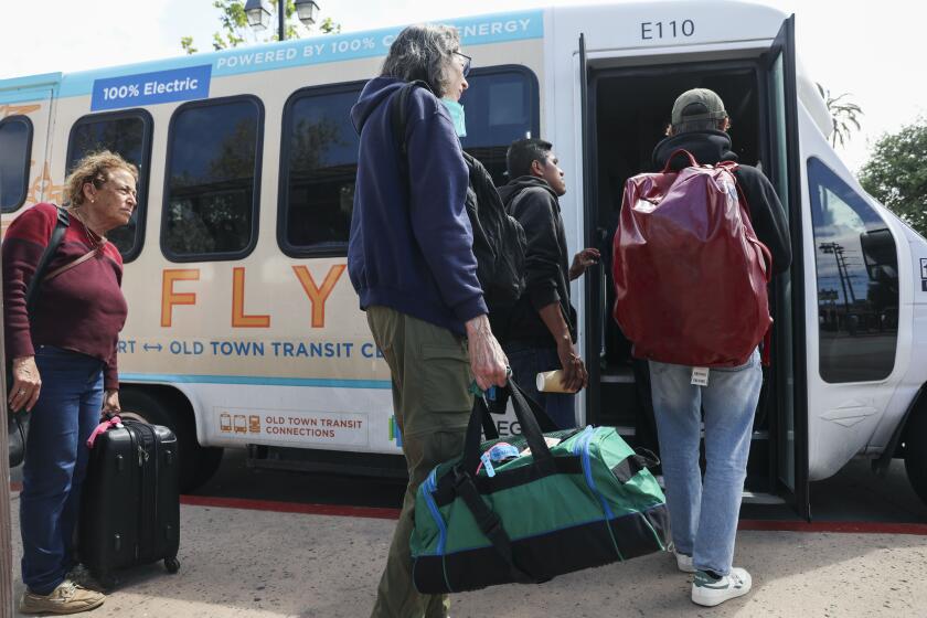 Passenger board the free airport shuttle bus at the Old Town Transit Center on Wednesday, April24, 2024 in San Diego.. (Photo by Sandy Huffaker for The SD Union-Tribune)