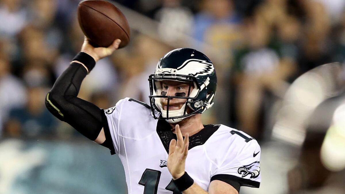 Eagles rookie quarterback Carson Wentz attempts a pass during an exhibition game Thursday.