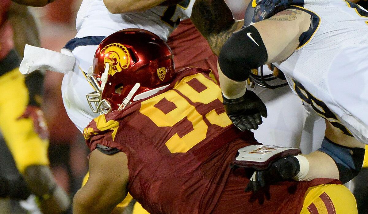 USC defensive tackle Antwaun Woods has undergone surgery for an injured pectoral muscle.