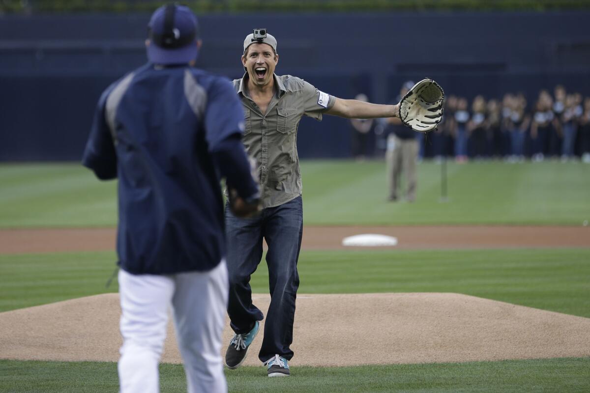 Nick Woodman, the founder and CEO of GoPro, wears a camera on his head after throwing out a ceremonial first pitch before the Padres play the Washington Nationals in San Diego.