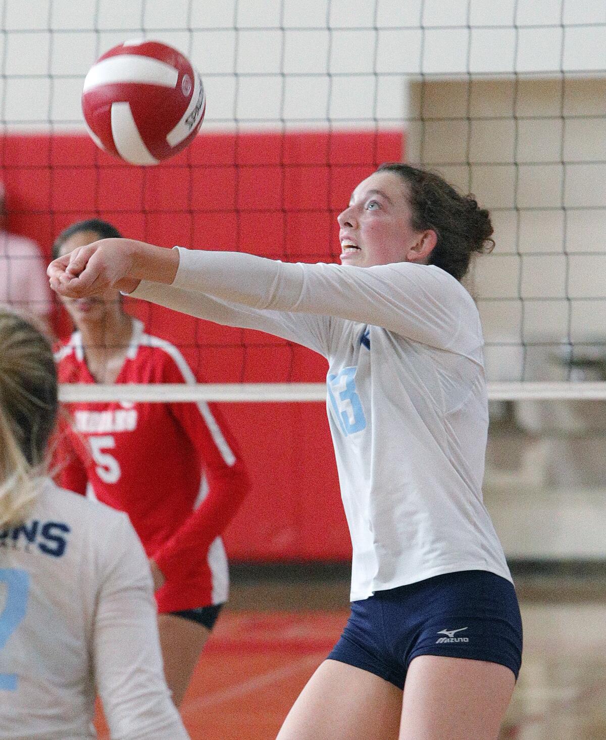 Crescenta Valley's Isabella Doom keeps the ball in play against Burroughs in a Pacific League girls' volleyball match at Burroughs High School on Tuesday, October 8, 2019.