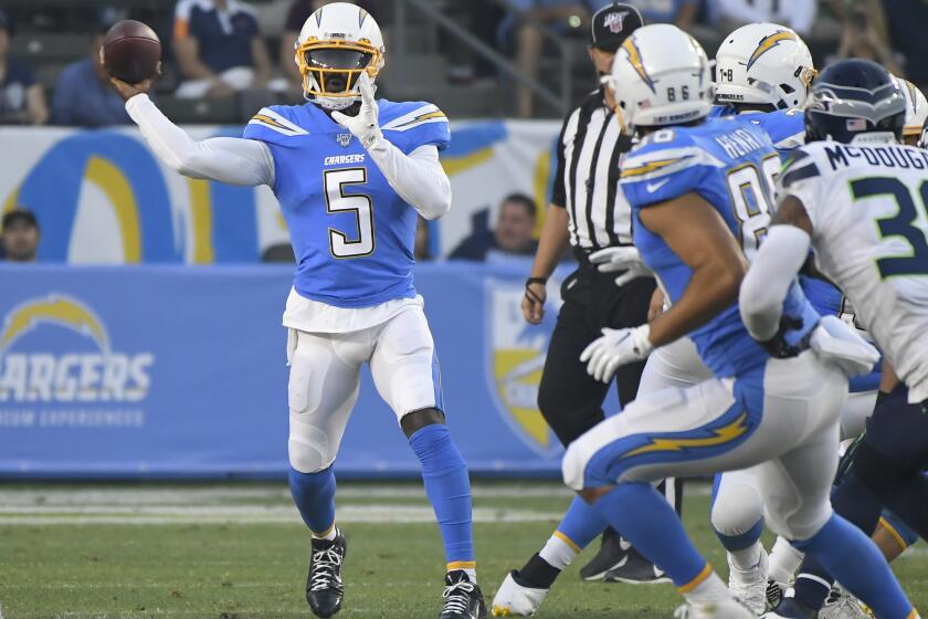 CARSON, CA - AUGUST 24: Tyrod Taylor #5 of the Los Angeles Chargers throws a short pass against the Seattle Seahawks in the first quaarter during a pre-season NFL football game at Dignity Health Sports Park on August 24, 2019 in Carson, California. (Photo by John McCoy/Getty Images)
