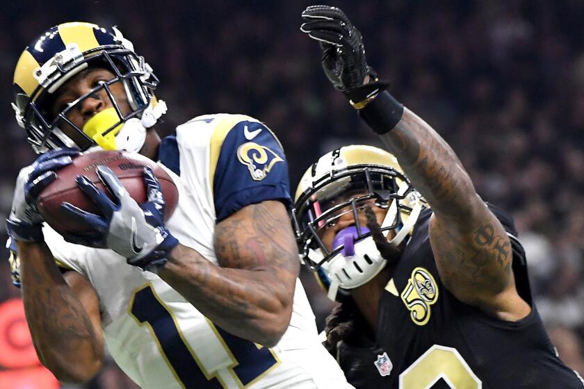 Rams receiver Tavon Austin hauls in Jared Goff's first touchdown pass againt Saints defensive back B.W. Webb during the first quarter Sunday.
