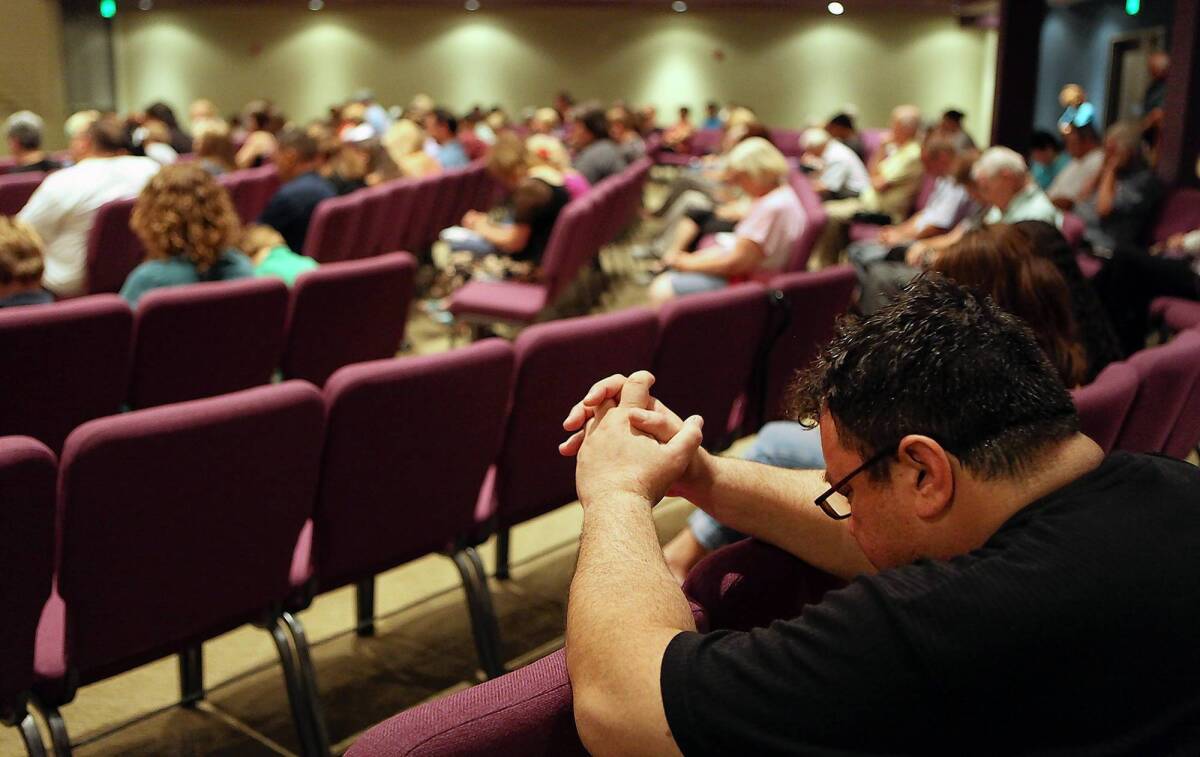 Congregants pray during services at West Valley Christian Church, where Wang Linjia and Ye Mengyuan and others had been headed to attend a church camp.