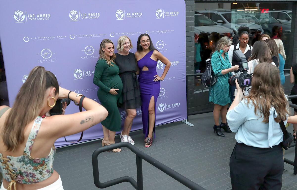 Co-chairs Kristy Olson, Jennifer Annes, and Brandi Marshall arrive to the event.