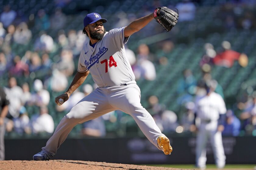 Dodgers relief pitcher Kenley Jansen throws against the Seattle Mariners