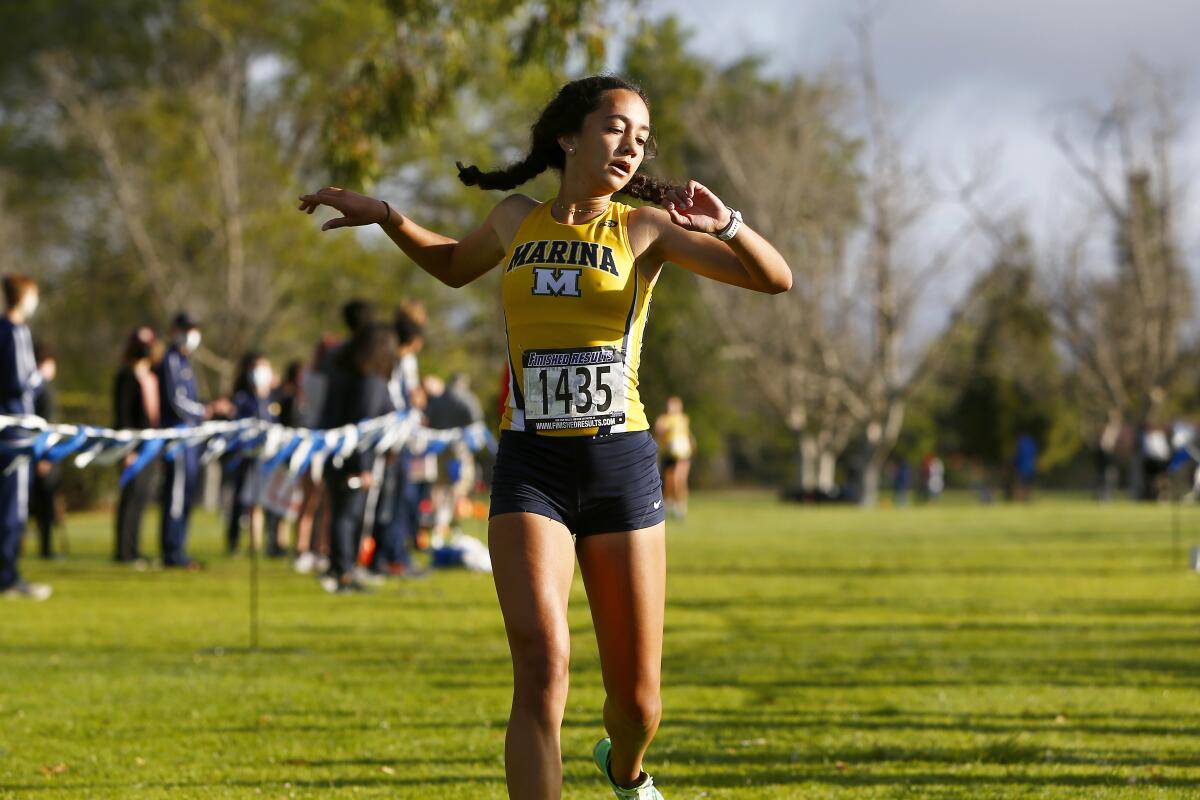 Marina's Makena Castillo finishes first for the Wave League girls in the Sunset Conference cross-country finals on Saturday.
