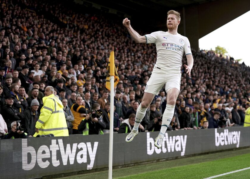 Manchester City's Kevin De Bruyne celebrates after scoring his first goal during the English Premier League soccer match between Wolverhampton Wanderers and Manchester City at Molineux stadium in Wolverhampton, England, Wednesday, May 11, 2022. (Nick Potts/PA via AP)