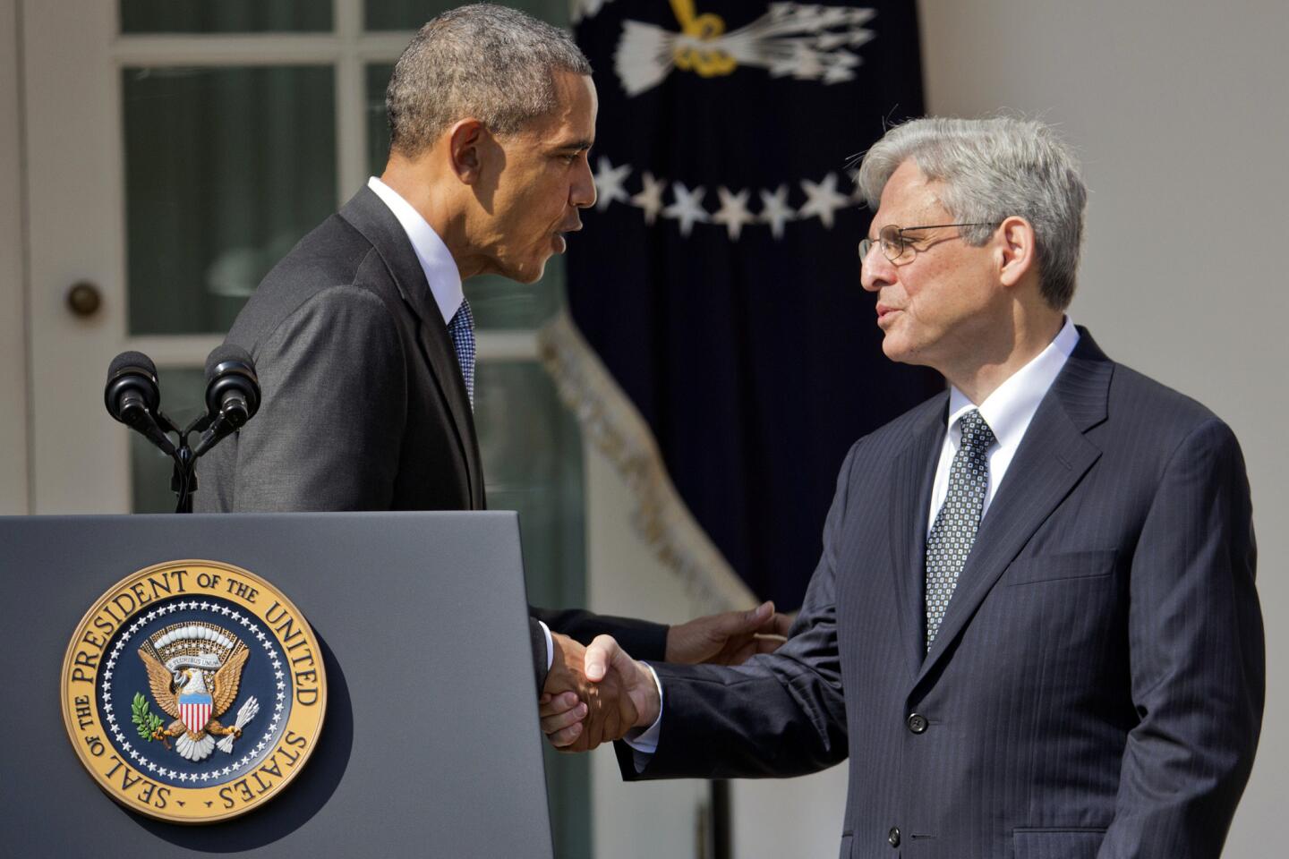 Federal appeals court Judge Merrick Garland, right, shakes hands with President Barack Obama as he is introduced as Obama's nominee for the Supreme Court on March 16, 2016.