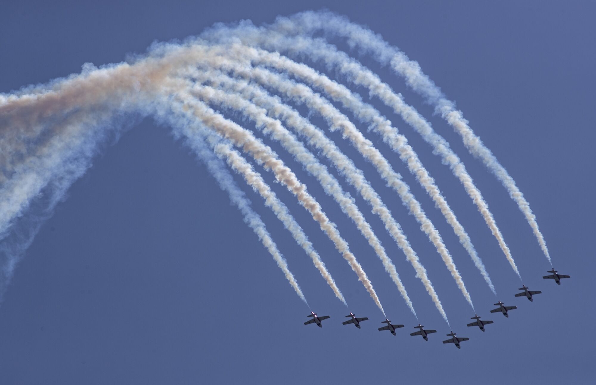 Canadian Forces Snowbirds fly in formation over the ocean