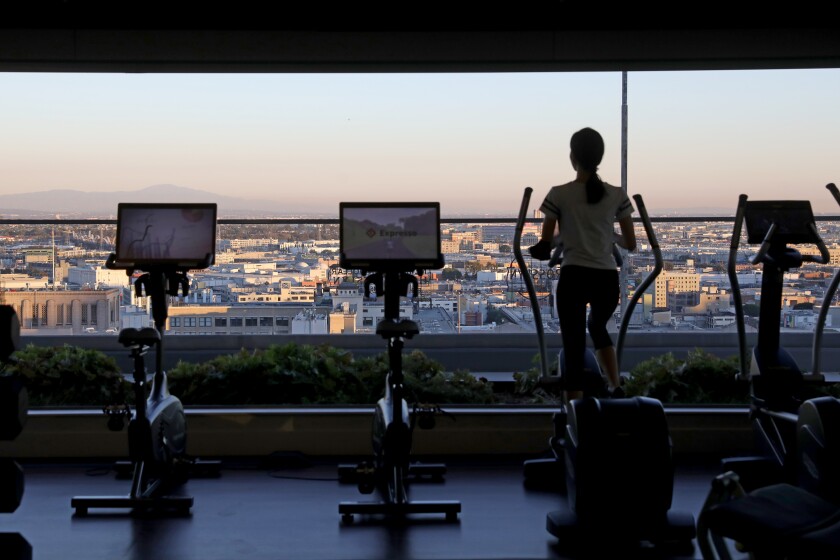Fitness center with views of downtown at Park Fifth Tower