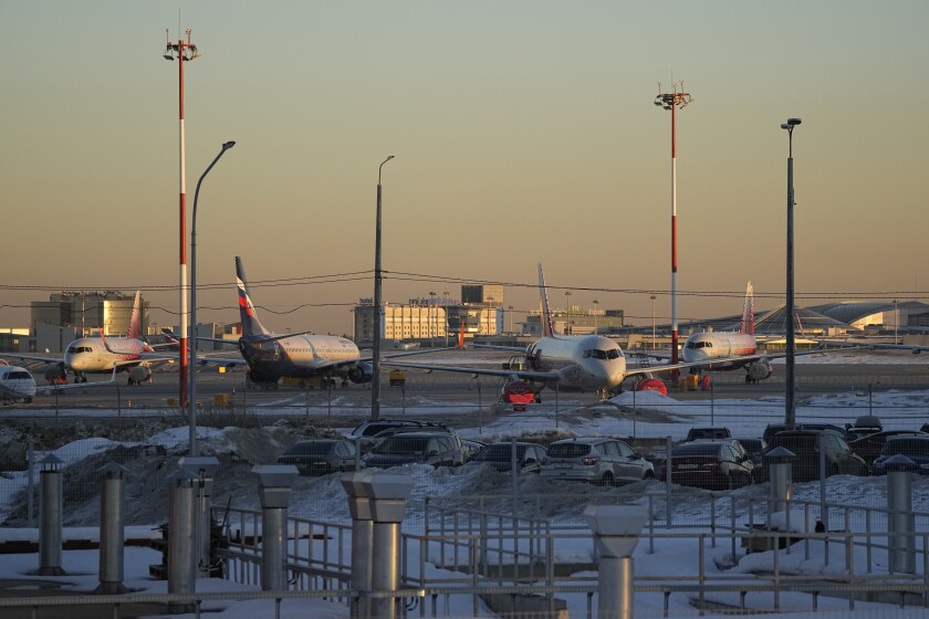 FILE - Passenger planes are parked at Sheremetyevo airport, outside Moscow, Russia, March 1, 2022. The fate of hundreds of planes leased by Russian airlines from foreign companies grew murkier Monday, March 14, 2022 after Russian President Vladimir Putin signed a law letting the airlines register those planes and continue flying them. (AP Photo/Pavel Golovkin, file)