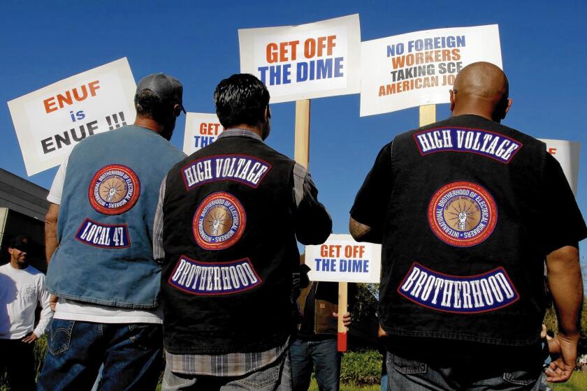 More than 300 members of the International Brotherhood of Electrical Workers rally Tuesday at the Southern California Edison offices in Irvine in support of their fellow Edison employees and protested what they say are unfair labor practices at the Southland’s largest utility.