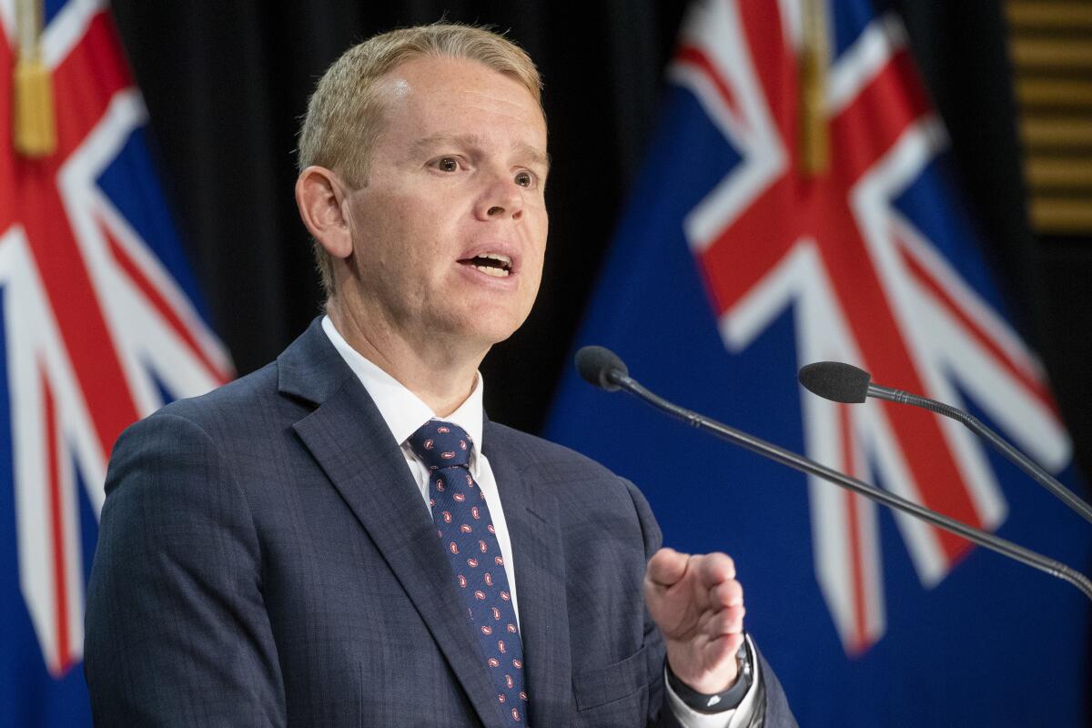 New Zealand Prime Minister Chris Hipkins gestures during his post-Cabinet press conference at Parliament in Wellington, New Zealand, Wednesday, Feb. 8, 2023. Hipkins said he was axing or delaying a number of his government's more contentious policy plans as he looked to refocus on priorities like the cost of living. (Mark Mitchell/NZ Herald via AP)