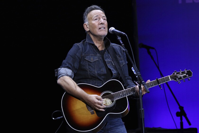 FILE - Bruce Springsteen performs at the 13th annual Stand Up For Heroes benefit concert in support of the Bob Woodruff Foundation in New York on Nov. 4, 2019. Springsteen is this year's winner of the Woody Guthrie Prize. The award honors artists of any medium who continue the legacy of the Oklahoma songwriter. Springsteen calls Guthrie one of his most important influences. The legendary performer will be honored in a virtual ceremony May 13. (Photo by Greg Allen/Invision/AP, File)
