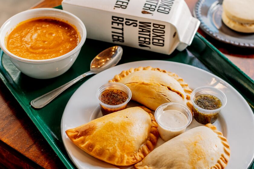 The lunch combo includes three empanadas, a drink and side of soup or salad