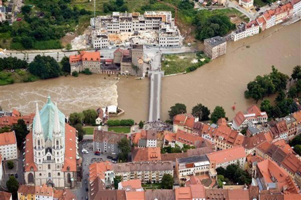 An aerial view of Neisse river shows parts of the city of Goerlitz, Eastern Germany, forground, and the Polish city of Zgorcelec on the other side of the swollen river, photographed on Sunday Aug. 8, 2010. The flooding in central Europe has struck an area near the borders of Poland, Germany and the Czech Republic. (AP Photo/ddp/ Jens Schlueter)