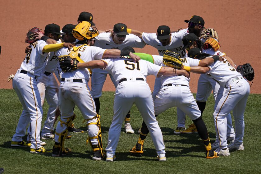 The Pittsburgh Pirates celebrate after getting the final out of a baseball game against the St. Louis Cardinals in Pittsburgh, Sunday, June 4, 2023. The Pirates won 2-1. (AP Photo/Gene J. Puskar)