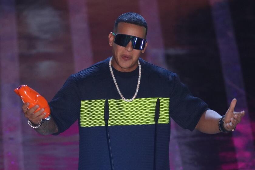 La colaboración entre Daddy Yankee (foto) y Marc Anthony llegará a una presentación ‘online’.