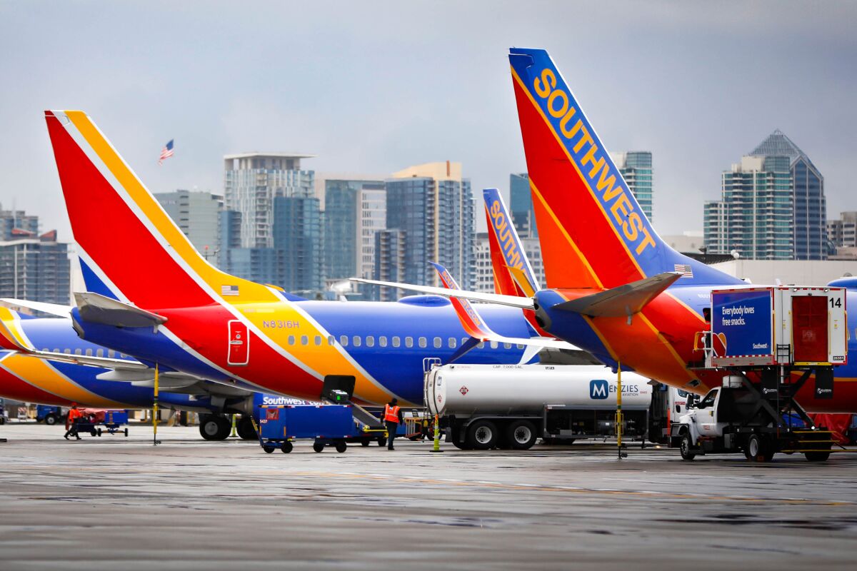 Southwest Airlines planes lined up at gates. 