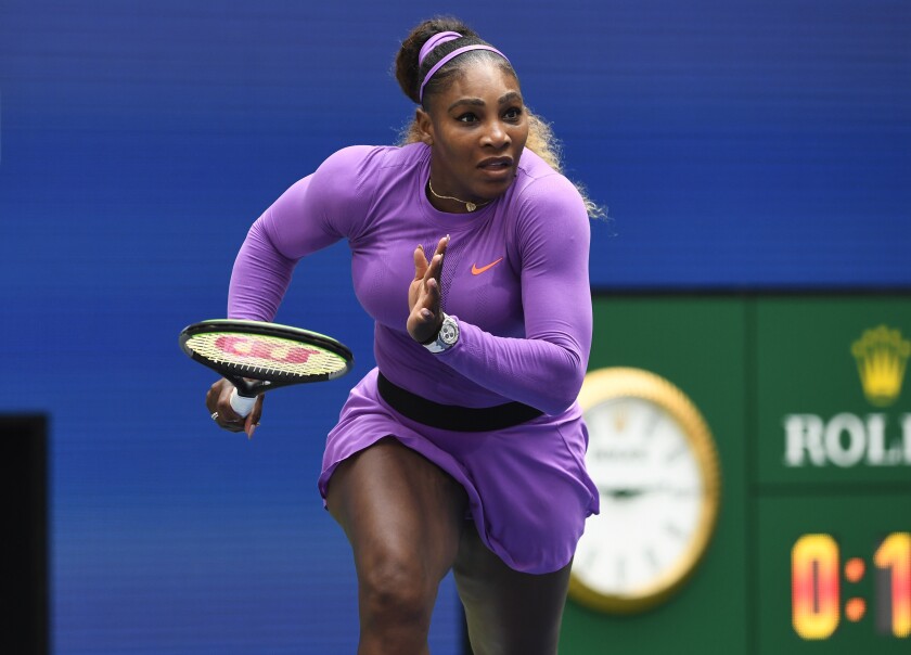 Serena Williams moves toward the net for a possible volley during her win over Petra Martic on Sunday at the U.S. Open.