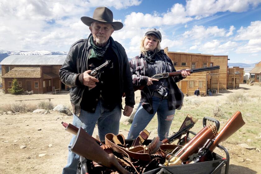 Armorer Thell Reed and daughter Hannah Gutierrez Reed, pose with guns