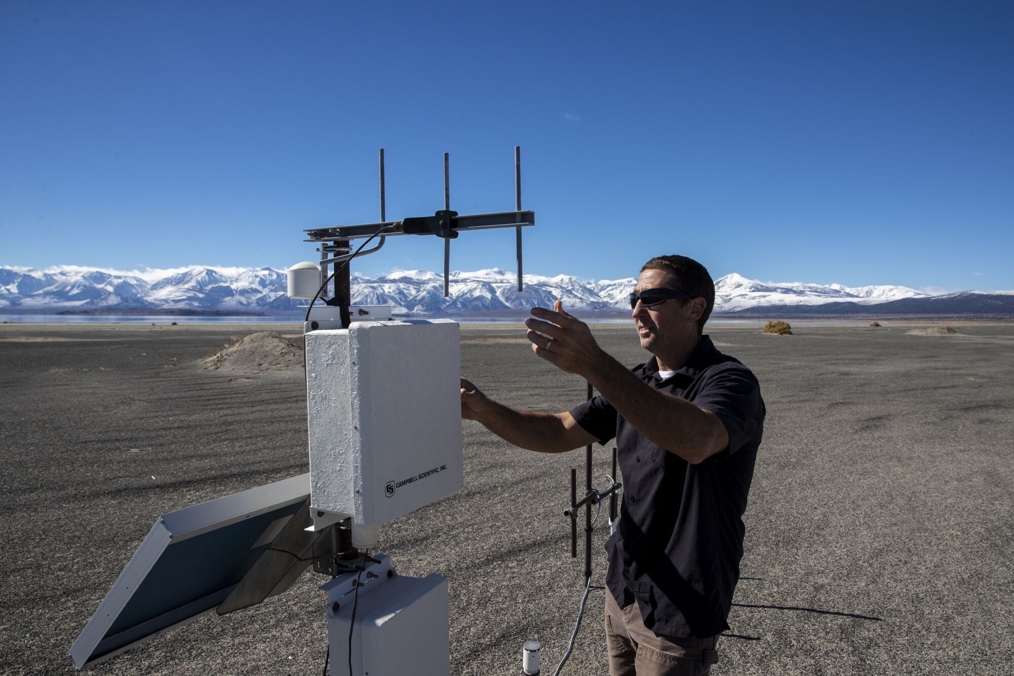 A man works with antennae.