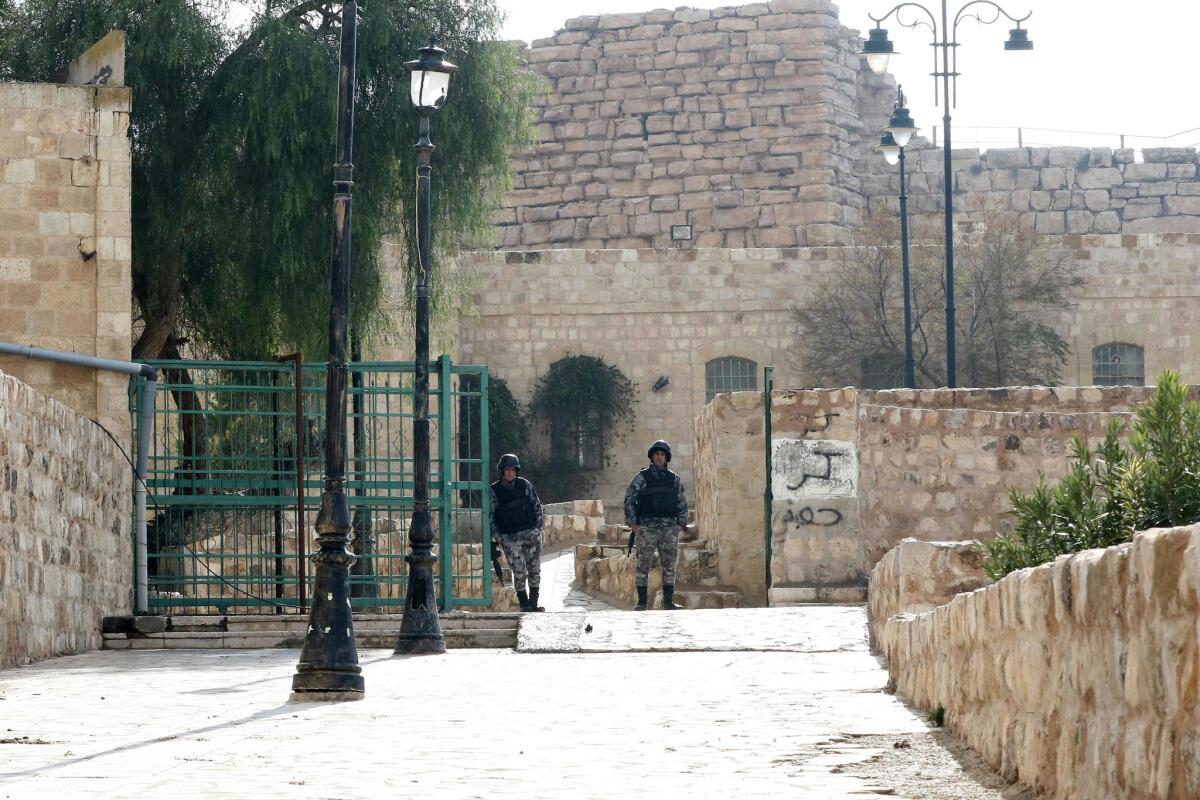 Jordanian security forces patrol around the Crusader castle in Karak on Dec. 19, a day after an attack that killed 10.