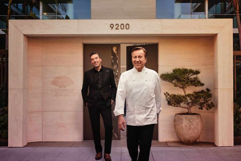 Chef Daniel Boulud, right, with Dinex Group CEO and business partner Sebastien Silvestri, will open the French chef's first West Coast restaurant within the next year.