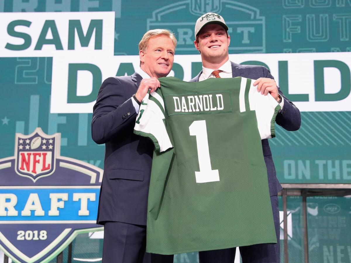  Sam Darnold  poses with NFL commissioner Roger Goodell after being picked third in the 2018 NFL draft by  the New York Jets.