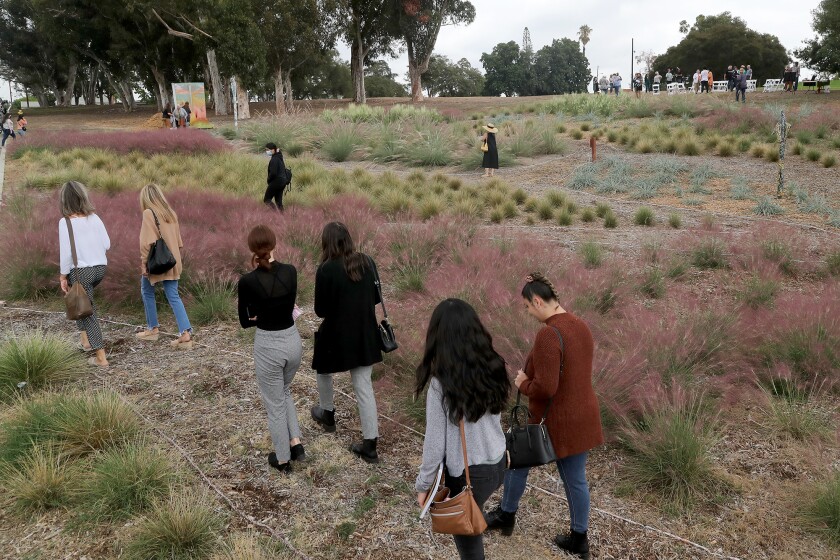 Visitors walk through the new "Sunset Garden" on Tuesday at the Muckenthaler Cultural Center in Fullerton.