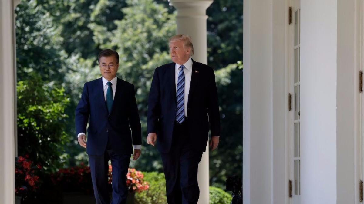 President Trump walks with South Korean President Moon Jae-in to the Rose Garden at the White House.