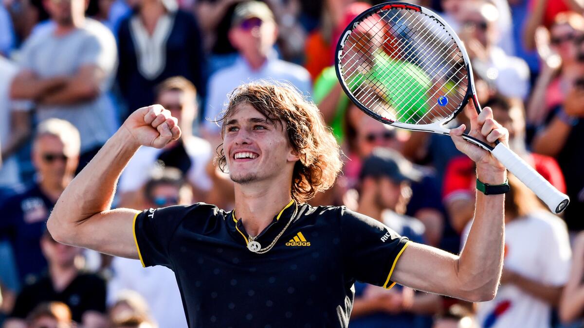 Alexander Zverev celebrates after defeating Roger Federer in the Rogers Cup championship match Sunday.