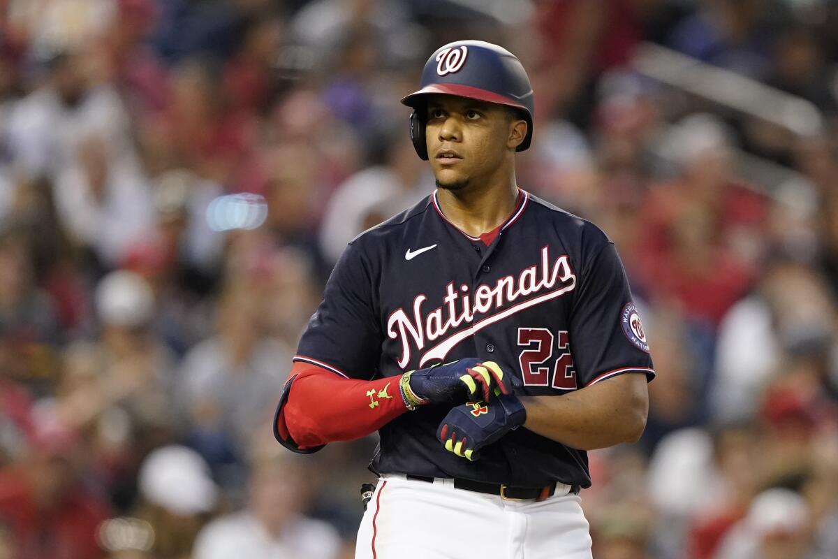 Washington Nationals star Juan Soto adjusts his batting gloves.