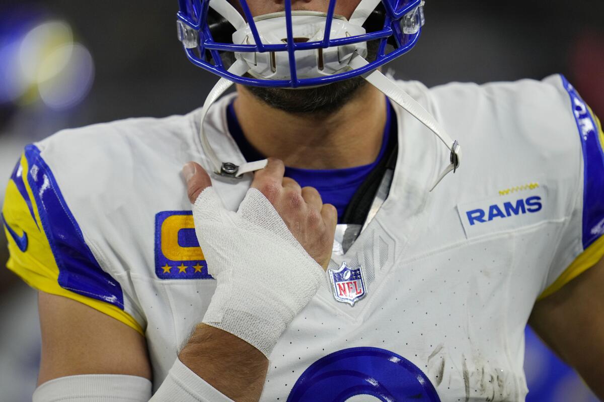 Rams quarterback Matthew Stafford wears a bandage after injuring his thumb against Dallas.