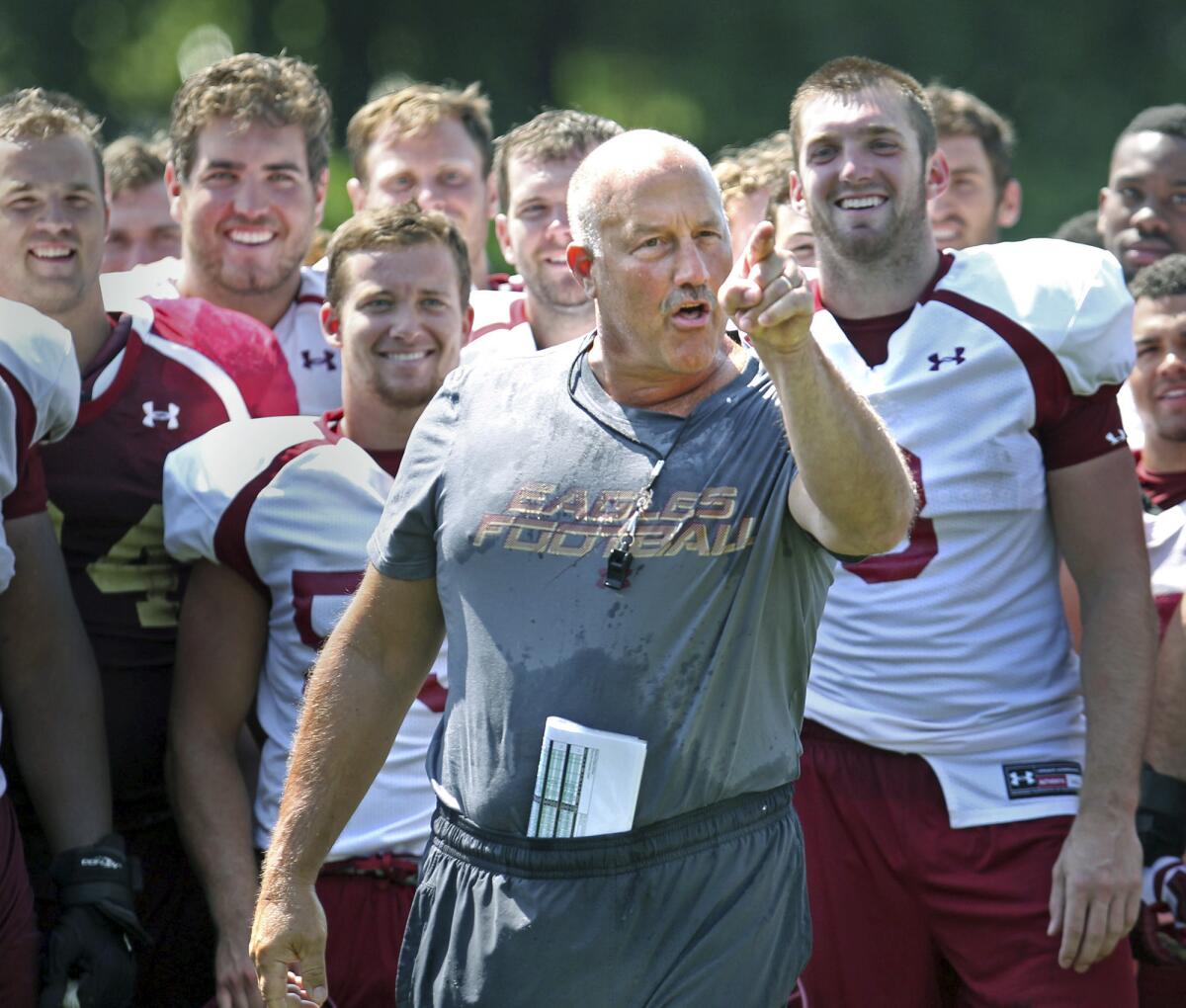 Boston College football Coach Steve Addazio gestures after being doused during the "ice bucket challenge".