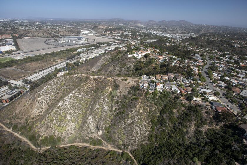 Heavy brush on the south side of interstate 8 where canyons cut in to ridge top neighborhoods. Photo made during a photo flight on Friday, October 18, 2019