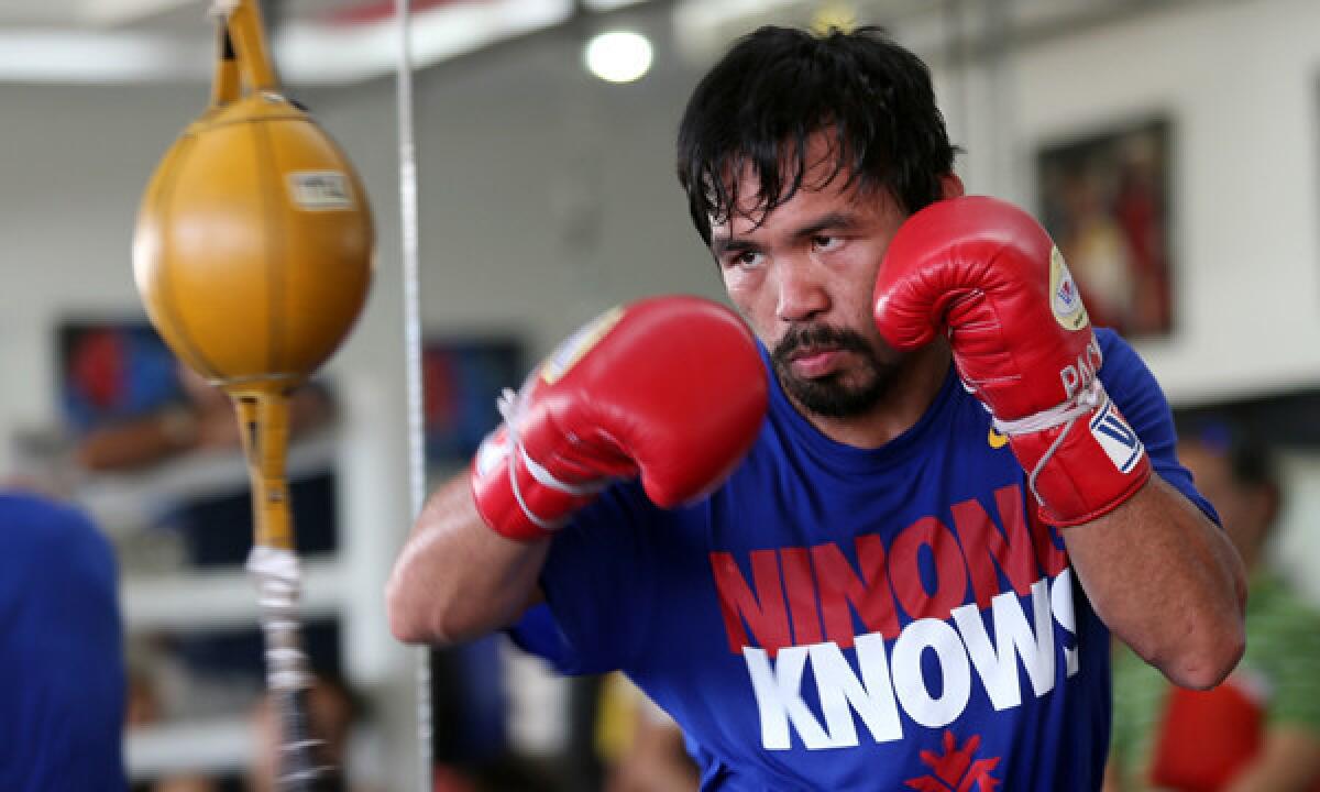 Manny Pacquiao takes part in a training session in the Philippines. Pacquaio will fight Timothy Bradley for the WBO welterweight title on April 12.
