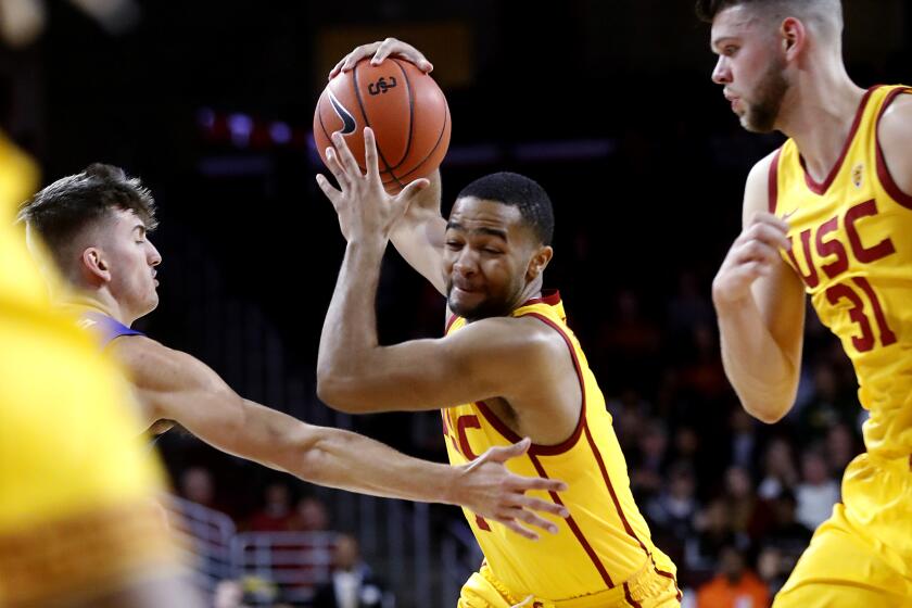 LOS ANGELES, CALIF. - DEC. 29, 2019. USC guard Kyle Sturdivant drives to the basket against FGCU in the first half Sunday night, Dec. 29, 2019, at Galen Center in Los Angeles. (Luis Sinco/Los Angeles Times)
