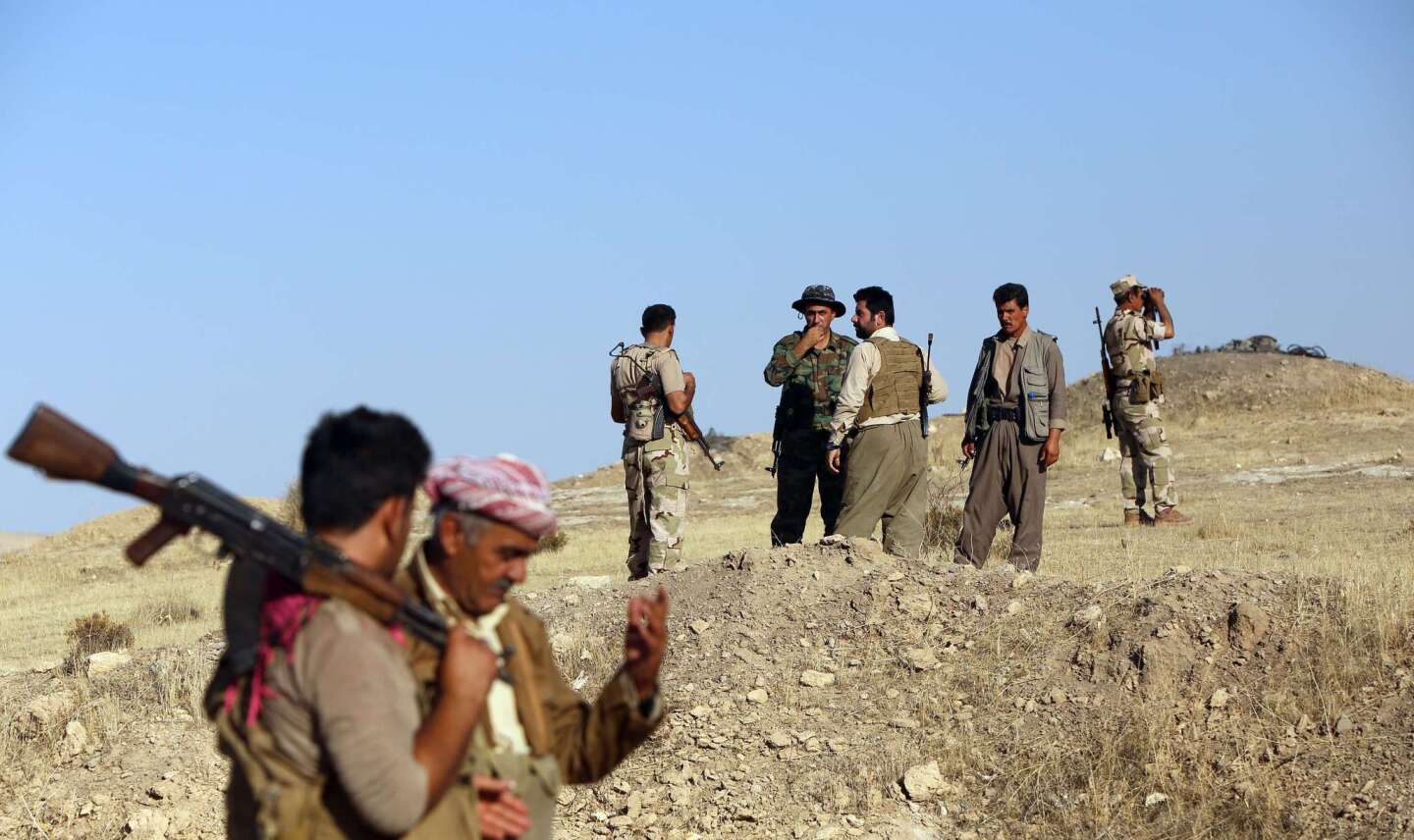 Kurdish Peshmerga fighters take position near the militant-held city of Zumar in Iraq's Mosul province on Sept. 4. Iraqi security forces, bolstered by thousands of Shiite Muslim militiamen and ethnic Kurdish fighters, have clawed back ground northeast of Baghdad.