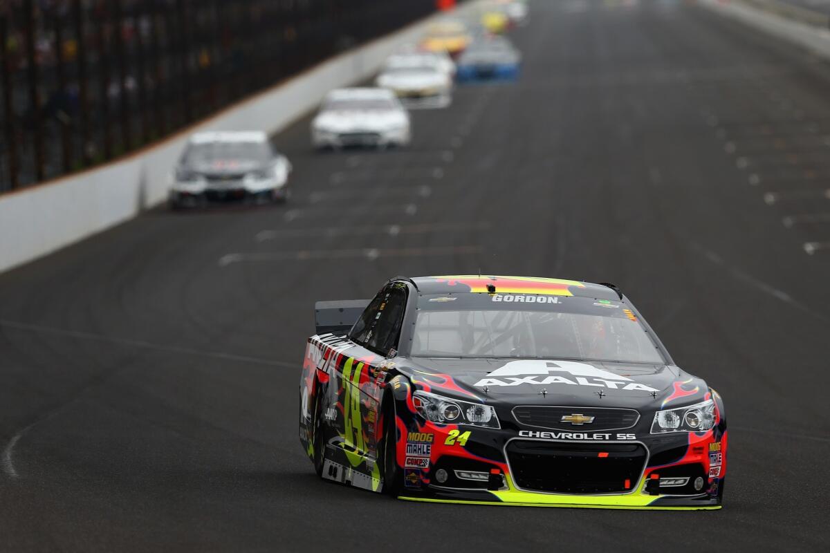 Jeff Gordon leads a pack of cars Sunday during the Brickyard 400 at Indianapolis Motor Speedway. Gordon nabbed his fifth victory at the Brickyard.